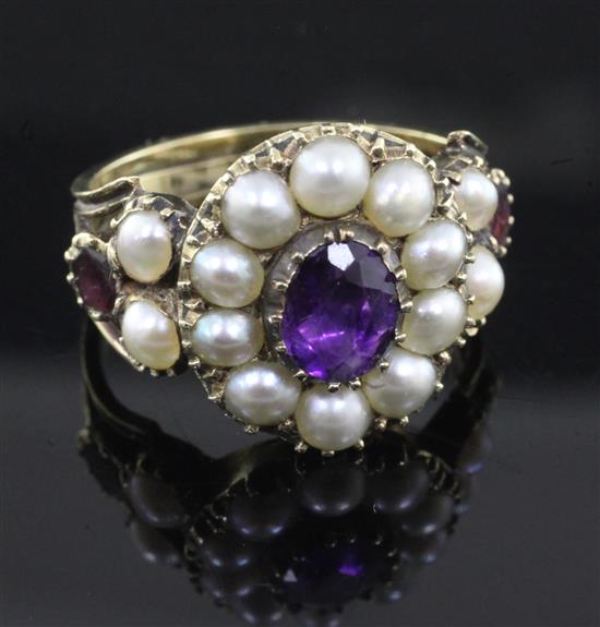 An antique gold, amethyst, garnet and pearl set cluster ring, size M.